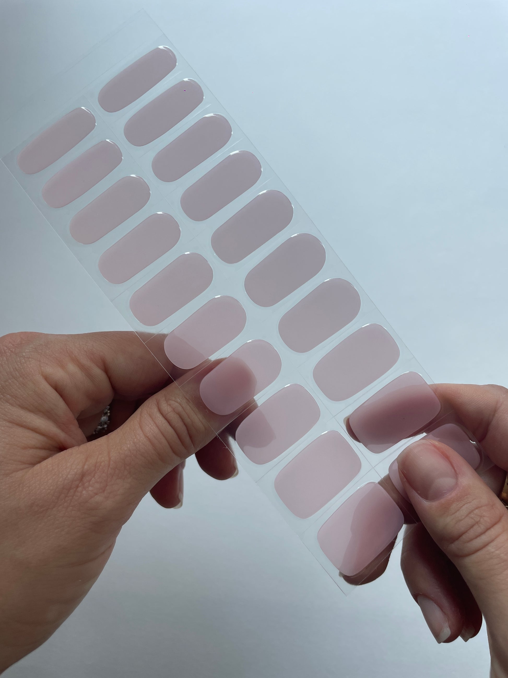 Glazed pink nail strip on finger example